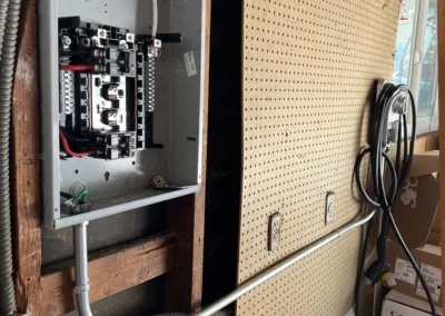 An electrical box with wires attached to it.